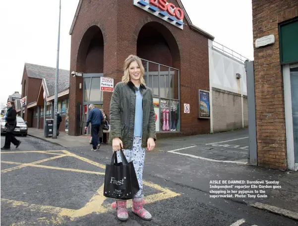  ??  ?? AISLE BE DAMNED: Daredevil ‘Sunday Independen­t’ reporter Elle Gordon goes shopping in her pyjamas to the supermarke­t. Photo: Tony Gavin