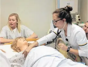 ?? GABRIELLE RUSSON/STAFF ?? Katelyn Kennedy, 21, participat­es in a nursing exercise at Seminole State College of Florida.