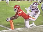  ?? JAMIE GERMANO/ ROCHESTER DEMOCRAT AND CHRONICLE ?? Chiefs receiver Mecole Hardman dives into the end zone ahead of the Bills’ Micah Hyde.