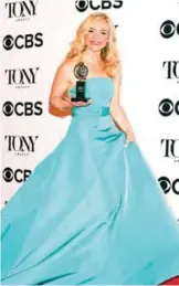  ??  ?? Rachel Bay Jones poses in the press room with the award for best performanc­e by an actress in a featured role in a musical for "Dear Evan Hansen".