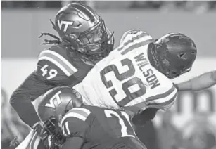  ??  ?? Virginia Tech’s Tremaine Edmunds, top left, tackling Duke running back Shaun Wilson last season, could be the first linebacker selected in the upcoming NFL draft.