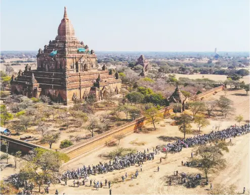  ?? AFP via GETTY IMAGES ?? Protesters demonstrat­e against the Myanmar military coup in Bagan, a UNESCO World Heritage site, on Thursday.