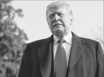  ?? AP PHOTO ?? President Donald Trump pauses as he talks to media before boarding Marine One on the South Lawn of the White House in Washington, Saturday, for the short trip to Andrews Air Force Base en route to Philadelph­ia to attend the Army-Navy Football Game.