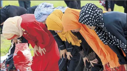  ?? EDD GUMBAN ?? Muslim women pray during the observance of Eid al-Adha, or the Feast of Sacrifice, at the Quirino Grandstand grounds in Manila yesterday.