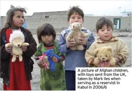  ??  ?? A picture of Afghan children, with toys sent from the UK, taken by Mark Iles when serving as a reservist in Kabul in 2006/6
