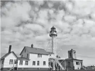  ?? Kelly Smith/Minneapoli­s Star Tribune/TNS ?? ■ Whitefish Point Lighthouse in Paradise, Mich., is the oldest operating light on Lake Superior.