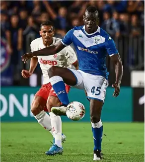  ?? — aFP ?? Not cool: mario balotelli (front) was a victim of racist abuse by verona fans while playing for brescia last weekend.