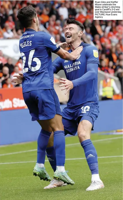  ?? PICTURE: Huw Evans Agency ?? Ryan Giles and Kieffer Moore celebrate the Wales striker’s clinching goal in Cardiff’s 2-0 win over Blackpool yesterday