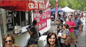  ?? BILL LACKEY/STAFF ?? People wait in line to sample some of the Firehouse Crab Balls at the 2016 Springfiel­d Rotary Gourmet Food Truck Competitio­n in Veterans Park.