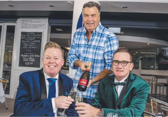  ?? Picture: JERAD WILLIAMS ?? Shuck Restaurant owner Scott Budgen (centre) with Andrew Meadowcrof­t and his partner Cameron Nobbs in Main Beach.