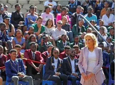  ?? AP PHOTO/DIRK HEINRICH ?? U.S. First lady Jill Biden, right, greets students Friday while on a visit to the University of Science and Technology in Windhoek, Namibia.