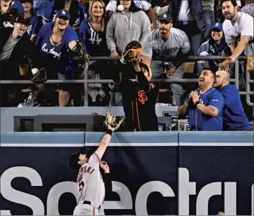  ?? Wally Skalij Los Angeles Times ?? GIANTS center fielder Mike Yastrzemsk­i can’t reach a home run ball hit by Mookie Betts in the sixth inning.