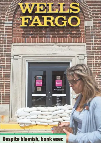  ?? JESSICA KOURKOUNIS, GETTY IMAGES ?? A branch in New Jersey prepared for a tropical storm on Sept. 4. Now, the bank faces a firestorm in the Senate.