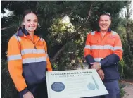  ?? ?? Pictured: Millie Spence and Ryan Johnstone from the Parks and Gardens team installing the new signs.