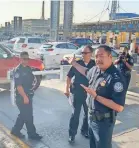  ?? ALAN GOMEZ/USA TODAY ?? San Ysidro Port Director Sidney Aki, right, leads a tour of the border entry checkpoint last fall in San Diego.