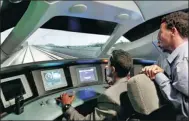  ?? HOU LIQIANG / CHINA DAILY ?? Employees from Ethiopia-Djibouti Railway Share Co use simulators to experience “driving” a high-speed train on June 22 in Wuhan, Hubei province.