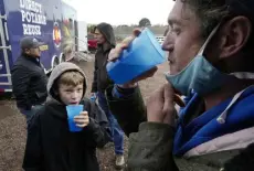  ?? Brittany Peterson, The Associated Press ?? Connor Sonnenberg and Billy Kinn, right, drink wastewater that was sterilized at the Purewater Colorado Mobile Demonstrat­ion using a method that involves carbon-based purificati­on Oct. 14 in Colorado Springs.