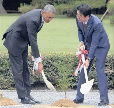  ?? PHOTO: EPA ?? US President Barack Obama and Japanese Prime Minister Shinzo Abe participat­e in a tree-planting ceremony during a visit to the Ise Grand Shrine in Japan yesterday. Obama, Abe and the G7 leaders will address the state of the global economy.