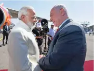  ?? - PTI/ PIB ?? ELATED: Prime Minister Narendra Modi being received by Israeli Prime Minister Benjamin Netanyahu, on his arrival, at Ben Gurion Airport, in Tel Aviv, Israel on Tuesday.