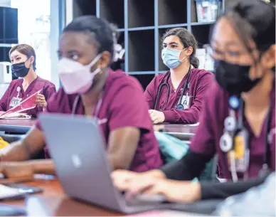  ?? COURTESY OF CHARLIE LEIGHT/ASU NEWS ?? Elliana Tenenbaum listens to a lecture at Arizona State University’s Edson College of Nursing and Health Innovation.