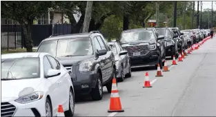  ?? DAVID J. PHILLIP — THE ASSOCIATED PRESS ?? People wait in line during a baby-formula drive to help with the formula shortage Saturday in Houston. The shortage is due to ongoing supply disruption­s and a recent safety recall.