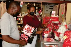  ?? ?? Love is in the air. . . This couple buys Valentine’s Day gifts at Valentine Shop in Mutare yesterday (Thursday).—Picture: Tinai Nyadzayo
