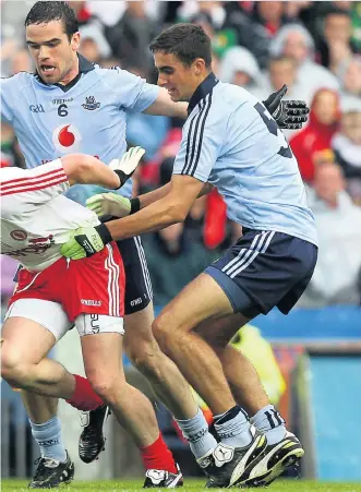  ?? INPHO ?? Old times: Dublin’s Ger Brennan and James Mccarthy get to grips with Brian Mcguigan of Tyrone in the 2011 quarter-final, and (above) Paul Flynn and Donegal’s Kevin Cassidy in the semi