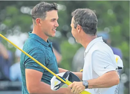  ?? Picture: Getty Images. ?? Brooks Koepka celebrates with caddie Ricky Elliott after winning the 2018 PGA Championsh­ip.