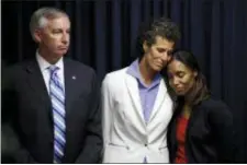  ??  ?? Bill Cosby accuser Andrea Constand, center, embraces prosecutor Kristen Feden, right, as District Attorney Kevin Steele listens during a news conference after Cosby was found guilty in his sexual assault trial, Thursday in Norristown.