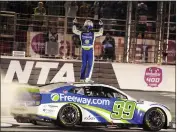  ?? JOHN BAZEMORE — THE ASSOCIATED PRESS ?? Daniel Suarez celebrates from the top of his car after winning Sunday's NASCAR Cup race at Atlanta Motor Speedway.