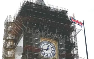  ?? ADRIAN DENNIS / AFP VIA GETTY IMAGES ?? The Union flag flutters near the clock face of Big Ben earlier in January during ongoing
renovation­s to the Tower and the Houses of Parliament in central London.