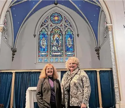  ?? ?? Mary K. Rosmus, parish life coordinato­r of the Battenkill Network of Roman Catholic Parishes, and Beth Ferrannini, the pastoral associate for Immaculate Conception Church, stand in front of the altar in the Immaculate Conception Church in Hoosick Falls.
