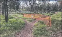  ??  ?? Signposts are placed at trailheads, not to stop the fun, but to ensure the longevity of trails for all users. PHOTO: DUBBO