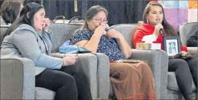  ?? THE CANADIAN PRESS/ANDREW VAUGHAN ?? Kindra Bernard, right, accompanie­d by her mother, Deana Beaton, left, holds a photo of her great-grandmothe­r, Mary Francis Paul, as she addresses the National Inquiry into Missing and Murdered Indigenous Women and Girls in Moncton on Wednesday....