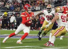  ?? JULIO CORTEZ — THE ASSOCIATED PRESS ?? Kansas City Chiefs quarterbac­k Patrick Mahomes, left, has helped the Chiefs to three Super Bowl titles in five seasons, the type of numbers that make a dynasty.