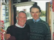  ?? ?? Dan Cooke and Maurice Corbett discussing the preparatio­ns for a cake sale in Anglesboro in 2002, hosted by Anglesboro Community Council, where proceeds went to the Irish Daffodil Society’s annual Daffodil Day.