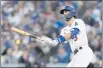  ?? JAE C. HONG — THE ASSOCIATED PRESS ?? The Los Angeles Dodgers’ Chris Taylor watches his two-run home run in the second inning against the Braves in Game 5of the NLCS on Thursday.