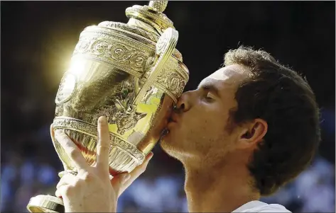  ?? AP file photo ?? Andy Murray kisses the men’s singles championsh­ip trophy after defeating Novak Djokovic in the Wimbledon final on July 7, 2013. Murray, 31, announced Friday that his retirement is imminent.