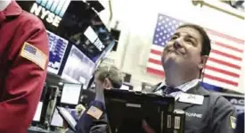  ??  ?? NEW YORK: Trader Ronald Franco works on the floor of the New York Stock Exchange yesterday. US stocks were little changed in early trading as technology companies rose and energy companies slipped with the price of oil. —AP