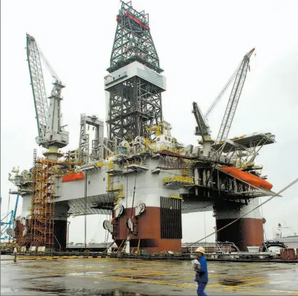  ?? MUNSHI AHMED / BLOOMBERG NEWS ?? Companies in Europe, Asia and the U.S. are racing to build offshore drilling rigs like this one, owned by Houston-based GlobalSant­eFe Corp.