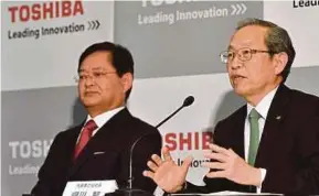 ?? EPA PIC ?? Toshiba Corp outgoing president and chief executive officer (CEO) Satoshi Tsunakawa (right) and newly appointed CEO and chairman Nobuaki Kurumatani at a news conference in Tokyo yesterday.
