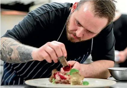  ?? CHRIS SKELTON / FAIRFAX NZ ?? Alex Aitken, head chef of Molten restaurant, shows how chocolate and blue cheese can delicately complement his venison tartare.