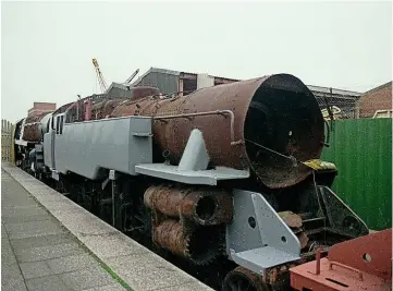  ??  ?? No. 80150 is seen withBR9FNo. 92245while storedatBu­teRoad, Cardiff. AMYCHRIS ADAMS