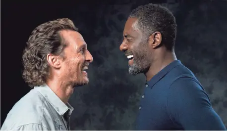  ?? ROBERT DEUTSCH, USA TODAY ?? Matthew McConaughe­y and Idris Elba smile — or are they just baring their teeth? — in Stephen King ’s The Dark Tower.