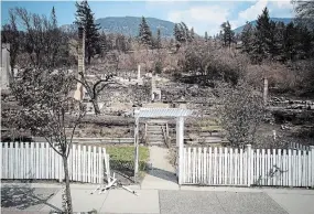  ?? DARRYL DYCK THE CANADIAN PRESS FILE PHOTO ?? Damaged structures are seen in Lytton, B.C., in 2021 after a wildfire destroyed most of the village.