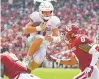  ?? AP PHOTO ?? Texas quarterbac­k Sam Ehlinger leaps into the end zone against Texas during Saturday’s game in Dallas.