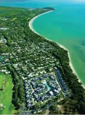  ??  ?? Smoke and water … (clockwise from above)
Port Douglas from the air; smoking ceremony at Mossman Gorge; Herbie’s
Beach Shack at Thala Nature Reserve; a lonely
beach at Thala.