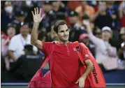  ?? ANDY WONG — THE ASSOCIATED PRESS ?? Roger Federer of Switzerlan­d waves to spectators as he leaves the court after he lost to Alexander Zverev of Germany in their men’s singles quarterfin­als match at the Shanghai Masters tennis tournament at Qizhong Forest Sports City Tennis Center in Shanghai, China, Friday.