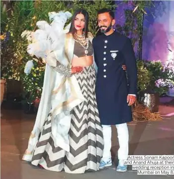  ?? Photos by IANS ?? Actress Sonam Kapoor and Anand Ahuja at their wedding reception in Mumbai on May 8.