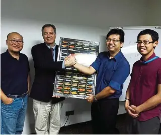  ??  ?? (From left) Tang, Dr Austin, chief operations officer of Biogenes Technologi­es Sdn Bhd Cheng Kim Sing and research fellow from Monash University Malaysia Dr Gan Ming Han have joined hands to develop genomics technology for the arowana industry.